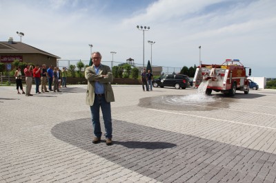 Urban Conservationist Wayne Peterson was present as 2,000 gallons of water were poured onto the new parking lot as a demonstration of the permeable ability of the new surface